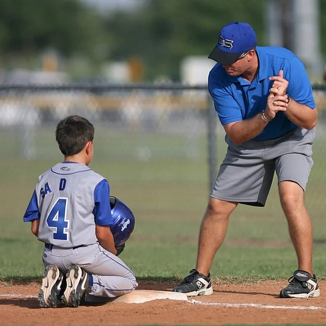 Sports coach with his baseball students.